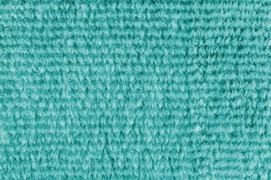 Terry bez, çizgili desenli turkuaz havlu dokusu. Yumuşak tüylü tekstil banyosu ya da mikrofiber plaj havlusu malzemesi. Üst manzara, kapat, makro.
