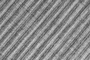Kadife kadife gri kumaştan tepe makro dokusu. Büyük tırtıklı, köşegen şeklinde kadife dokuma, çizgili döşeme kumaşı kumaş arka plan, mobilya tekstil malzemesi, tasarım, dekor