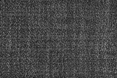 Döşeme siyah renkli Jacquard kumaş kabartma dokusu. Tekstil arka planı, mobilya tekstil malzemesi, duvar kağıdı, fon. Kumaş yapısı kapat, makro