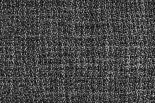 Döşeme siyah renkli Jacquard kumaş kabartma dokusu. Tekstil arka planı, mobilya tekstil malzemesi, duvar kağıdı, fon. Kumaş yapısı kapat, makro