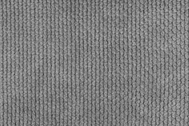 Kadife desenli gri kumaş kabarık örgü yakın, makro örülmüş kalın. Tekstil arka planı, mobilya tekstil malzemesi, duvar kağıdı, fon. Kumaş yapısı kapat, makro.