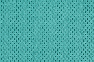 Düz turkuaz kadife döşeme kumaşı, makroyla tüylü Jacquard örgü dokusu arka planı, kumaş tekstil yüzeyi. Duvar kağıdı, kopyalama alanı olan arkaplan