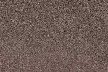 Asfalt, alçı, çimento, plastik, taş, taş, kapak, makro. Kahverengi granüler duvar yüzeyinin arka planı, kaba zemin