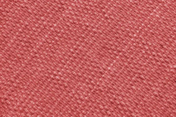 Büyük çapraz dokuması olan kırmızı doğal kumaş dokusu. Yüzey, döşeme ya da halı malzemesi yapısı, kumaş arka plan kapat.