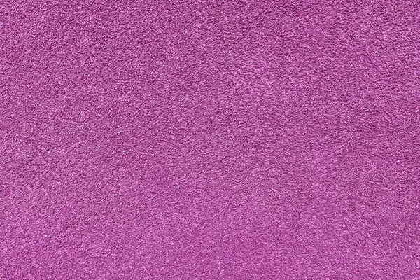 Asfalt, alçı, çimento, plastik, taş, taş, kapak, makro. Pembe granüler duvar yüzeyinin arka planı, pürüzlü arkaplan