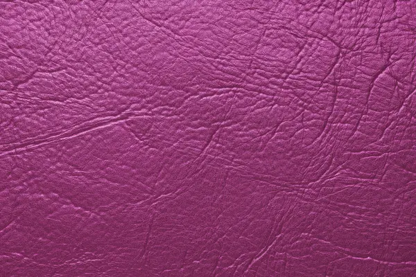 Yakın çekim, pembe parlak doğal deri, deri kaplama, kabartmalı desenli sanatsal deri yüzeyi. Arkaplan, duvar kağıdı, arkaplan