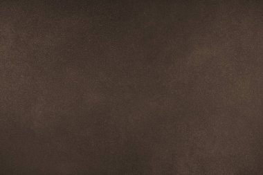Koyu kahverengi mat renginin farklı tonlarına sahip soyut grungy desen arkaplanı. Boyanmış tuval, beton yüzey, stüdyo arkaplanı, kumlu desenli efekt