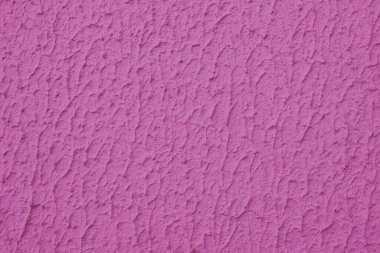 Kapalı desenli pembe boyalı duvar, kaba sıva, alçı duvar dokusu. Canlı arkaplan, duvar kağıdı, arkaplan, tasarım ögesi.