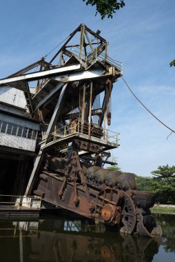 Tanjung Tualang, Batu Gajah, Perak, Malezya - Malayan Tin Dredging (MTD), Ocak 1913 'ten bu yana Batu Gajah' da ilk tarlayı tanıttı. Şimdi tüm ziyaretçilere açık. 