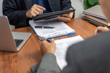 manager or hr reading a resume during a job interview of employees who apply for jobs Application.
