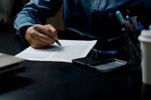 businessman agree to make deal signing document, sale contract or legal transaction contract at desk