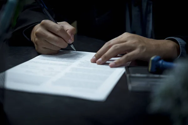 businessman agree to make deal signing document, sale contract or legal transaction contract at desk