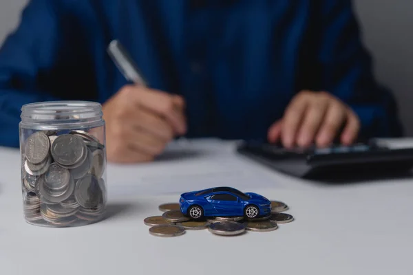 Executing a car purchase or lease agreement involves arranging a car loan and insurance coverage.