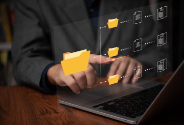 IT working on computer Business processes Document Management System DMS business processes and ensuring digital security. store, share, and organize documents and files.	