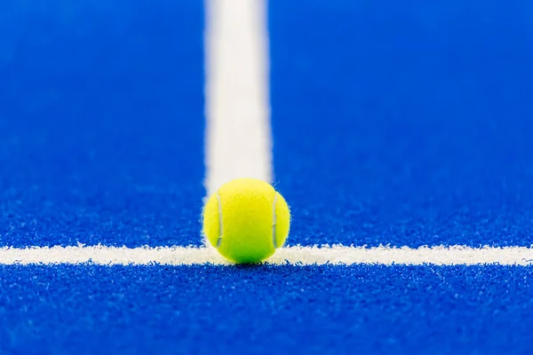 stock image Paddle tennis and tennis ball with white lines on blue court.  Horizontal sport poster, greeting cards, headers, website