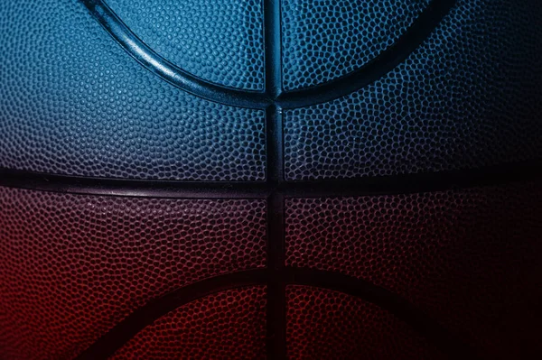 Closeup detail of blue and red basketball ball texture background. Horizontal sport theme poster, greeting cards, headers, website and app