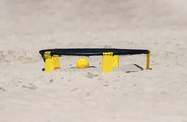 Spike ball game with yellow ball on sand. Summer game concept. Horizontal sport theme poster, greeting cards, headers, website and app