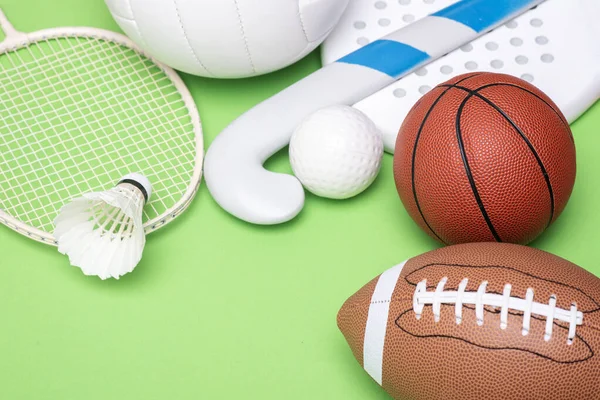 Sports equipment, rackets and balls on green background. Horizontal education and sport poster, greeting cards, headers, websit