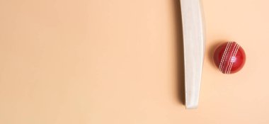 Yeşil arka planda kriket sopası ve kırmızı toplar. Yatay spor temalı poster, tebrik kartları, başlıklar, web sitesi ve uygulama