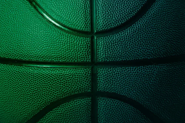 Closeup detail of blue and green basketball ball texture background. Horizontal sport theme poster, greeting cards, headers, website and app