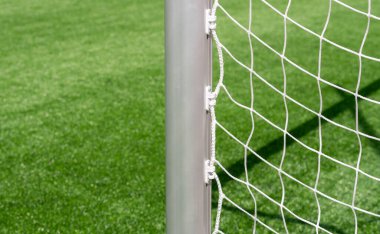 Hokey sahası, futbol, Amerikan futbolu, yeşil çimlerin ve bulanık stadyumun üzerinde lakros ağı. Yatay spor posteri, tebrik kartları, başlıklar, web sitesi