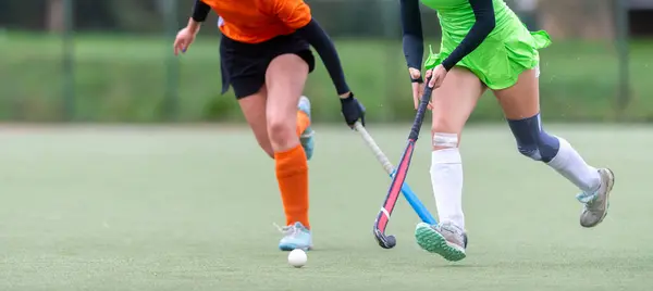 Field Hockey player, ready to pass the ball to a team mate. Horizontal sport theme poster, greeting cards, headers, website and app