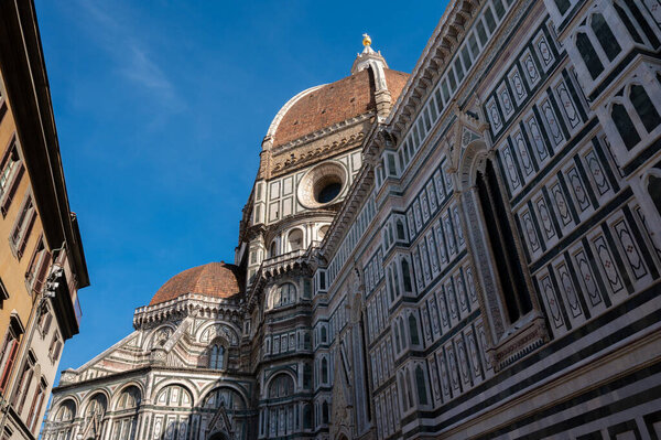 A landscape around Florence Cathedral (Duomo di Firenze), formally the Cathedral of Saint Mary of the Flower (Santa Maria del Fiore), a part of the UNESCO World Heritage Site covering in Florence, Italy