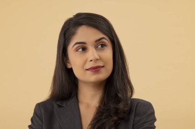 Close-up portrait of a young businesswoman looking elsewhere clipart