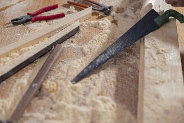 PICTURE OF A DESK WITH CARPENTING TOOLS AND DUST clipart