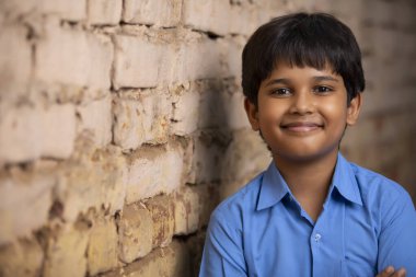 PORTRAIT OF A RURAL BOY SMILING AT CAMERA clipart