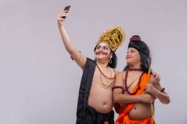 ram and ravan clicking selfie together clipart