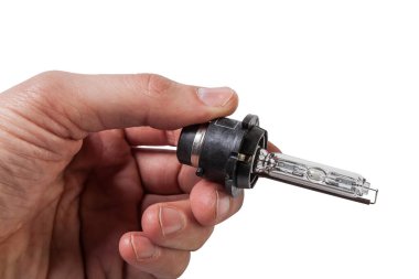 Otomotiv elektrikli parçaları - beyaz arka planda yeni beyaz 12V ksenon far lambası - gaz boşaltımı lambası. Yedek parça otomatik kataloğu.