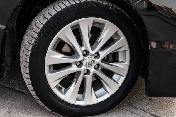 Pavlodar, Kazakhstan - 05.23.2023: Front light alloy wheel of Toyota Vellfire japanese luxury minivan car