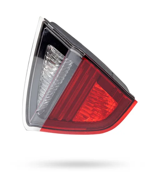 A pair of headlights of a stop signal for a German auto - optical equipment of white and red color on a white isolated background. A spare part for repair and sale in a car service center.