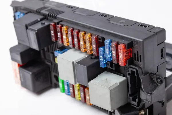 stock image Automotive fuses box in different colors and each color is responsible for the specific value of the protection defined in amperes. Catalog of spare parts.