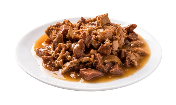 Wet cat food on a white plate cutout. Feeding plate full of meat and liver pieces in a sauce for cats isolated on a white background. Canned meat for domestic pet animals concept. Front view.
