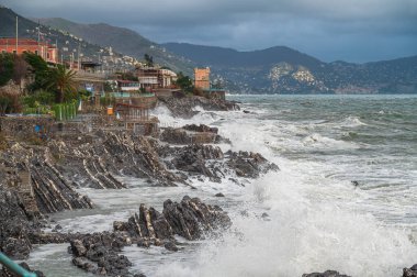 Waves on the promenade on the cliffs of Nervi, in the outskirts of Genoa, Italy