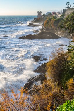 Waves on the promenade on the cliffs of Nervi, in the outskirts of Genoa, Italy
