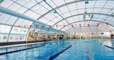 Indoor swimming pool with fiberglas covertop with swimming lanes seperation