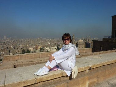 Woman on the background of Cairo Egypt