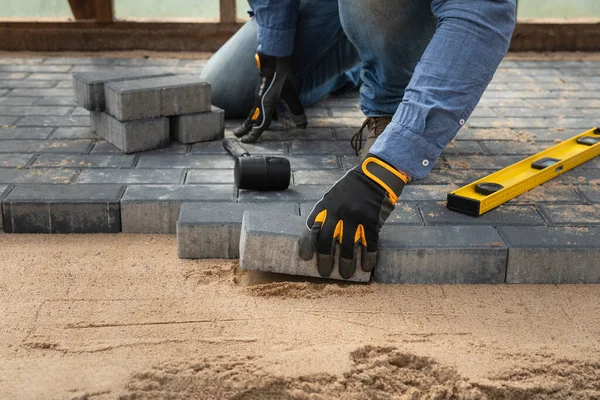 Laying Cement Pavement Walkway Rubber Hammer Gloves Sand House Improvement Royalty Free Stock Images