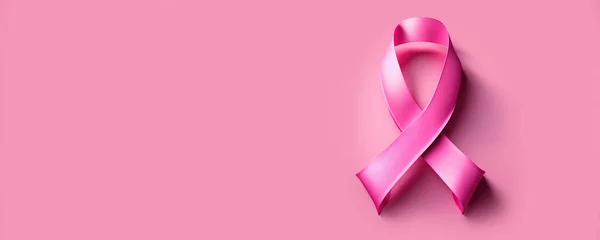 Pink cancer awareness ribbon banner or header background with copy space