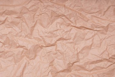 crumpled creased brown paper background texture pattern