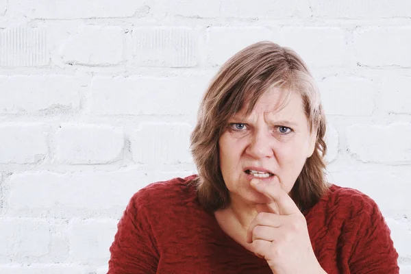 Mature Lady Looking Confused Royalty Free Stock Photos