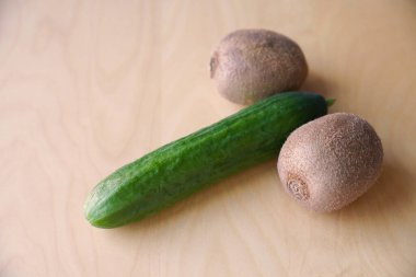 cucumber and kiwis as phallic symbol for penis and testicles