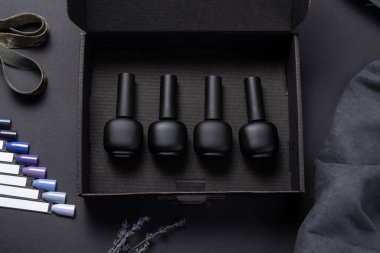 setof gel nail polish on black background with tips