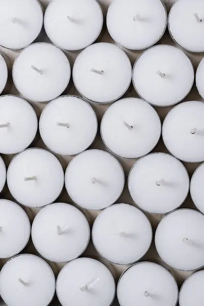 Lot of White Tealight Candles in Bulk, background