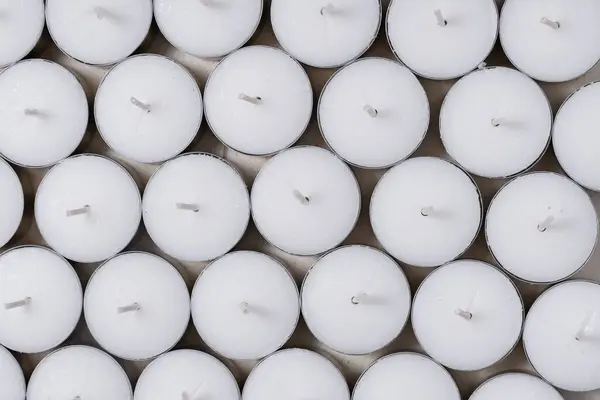 Lot of White Tealight Candles in Bulk, background