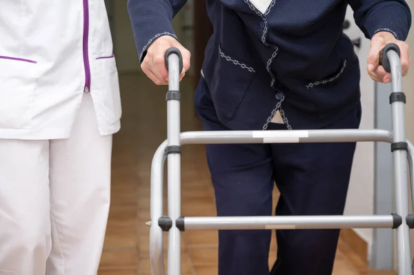 Nurse Assists Her Senior Patient Folding Walker Recuperation Elderly Seniors — Stock Photo, Image
