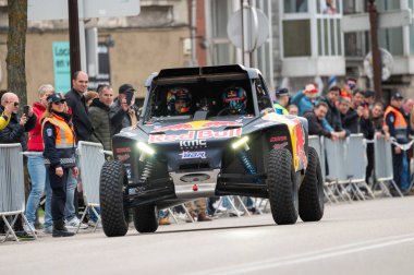 Burgos, Spain - March 16 - 2024 : Driver Cristina Gutierrez during a street exhibition after become champion of 2024 Dakar Rally in T3 category. High quality photo clipart